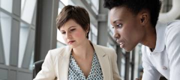 Two employees working in the office