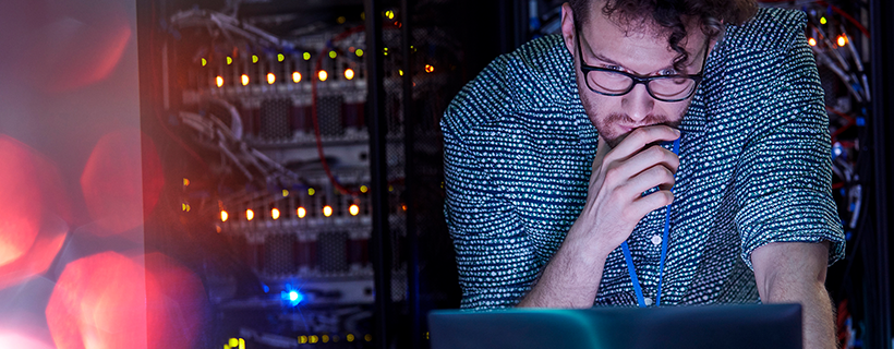 IT Helpdesk Manager working in server room