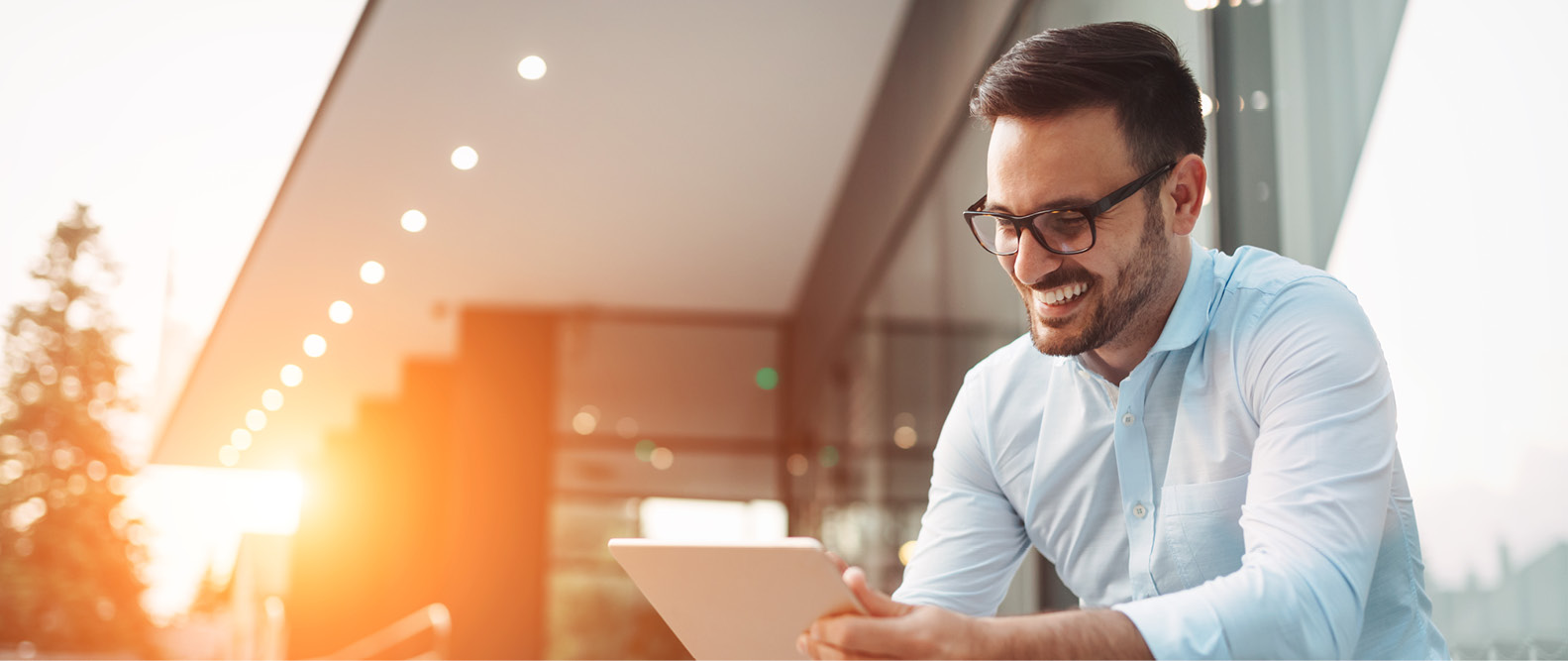 A man smiling and working