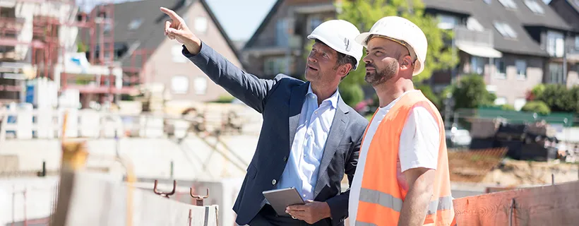 Trades & labourer workers on building site