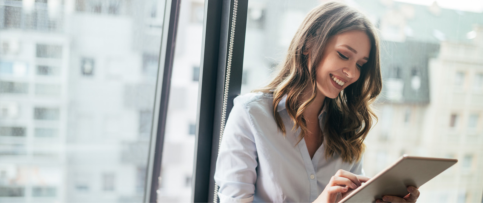 A woman working and smiling